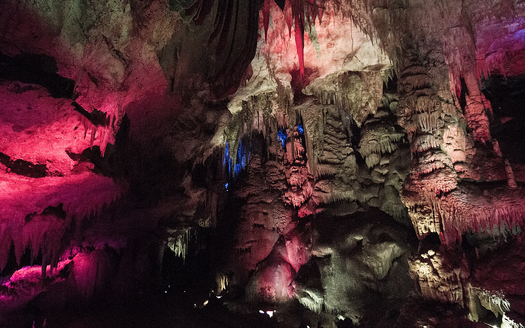 Illuminated stalactites inside Prometheus Cave in Georgia