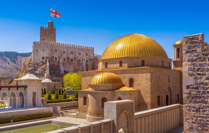 Rabati Fortress in Akhaltsikhe with golden domes under a blue sky