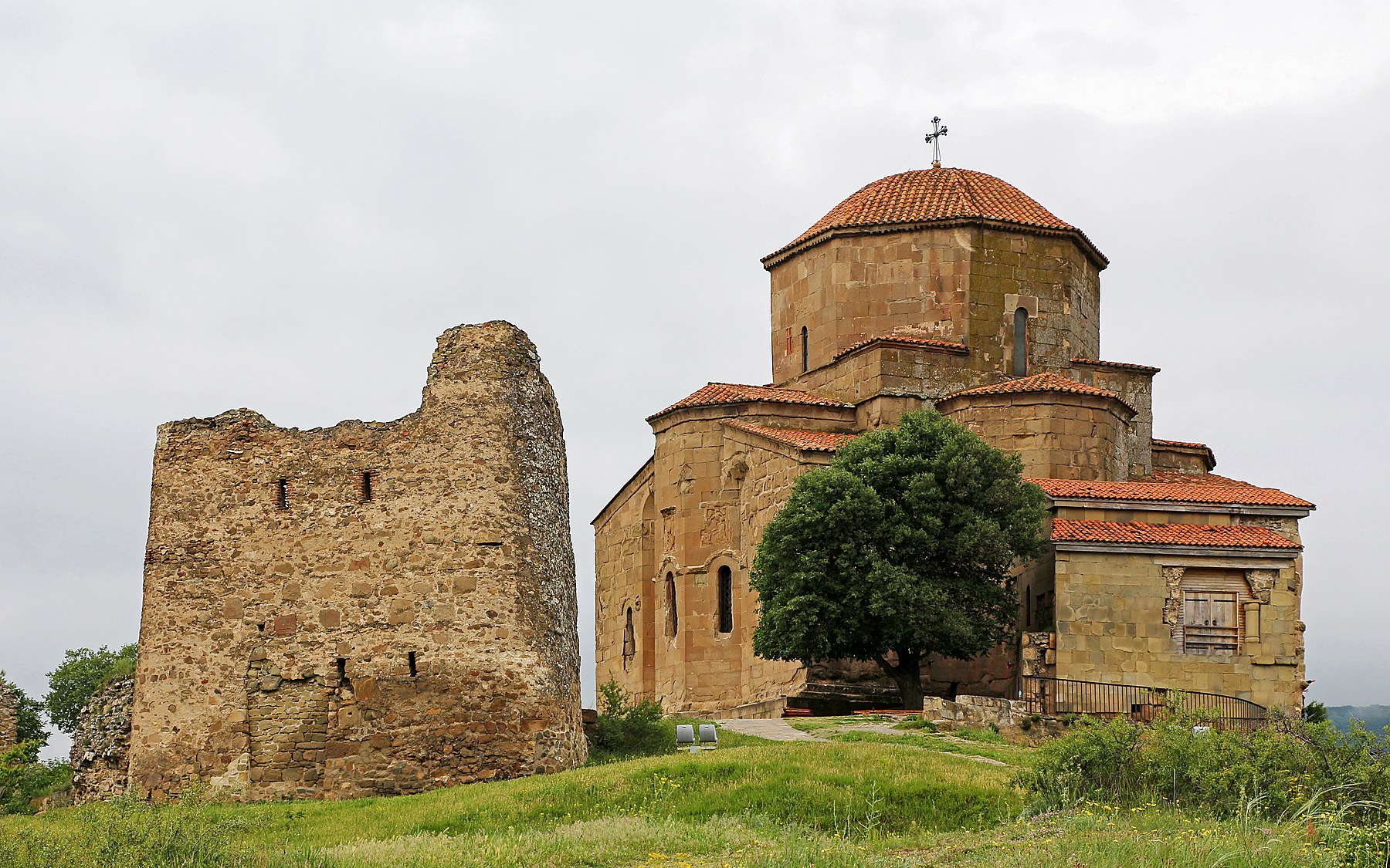 Jvari Monastery above the river confluence at sunset