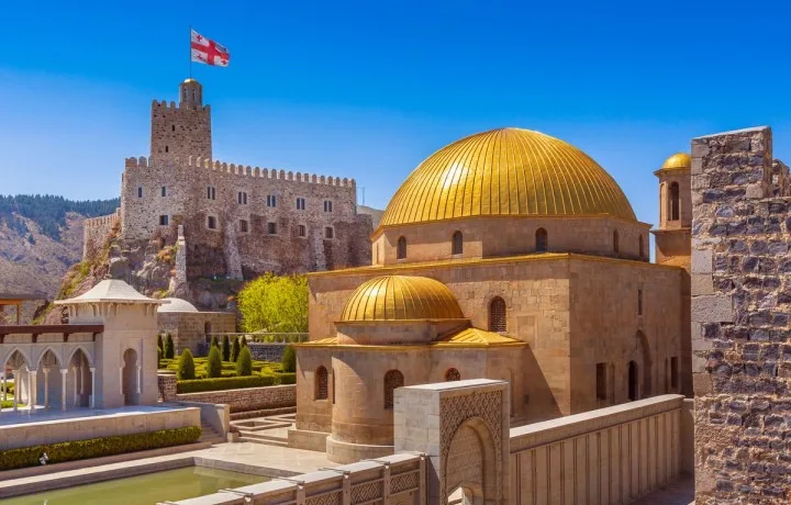 Rabati Fortress in Akhaltsikhe with golden domes under a blue sky