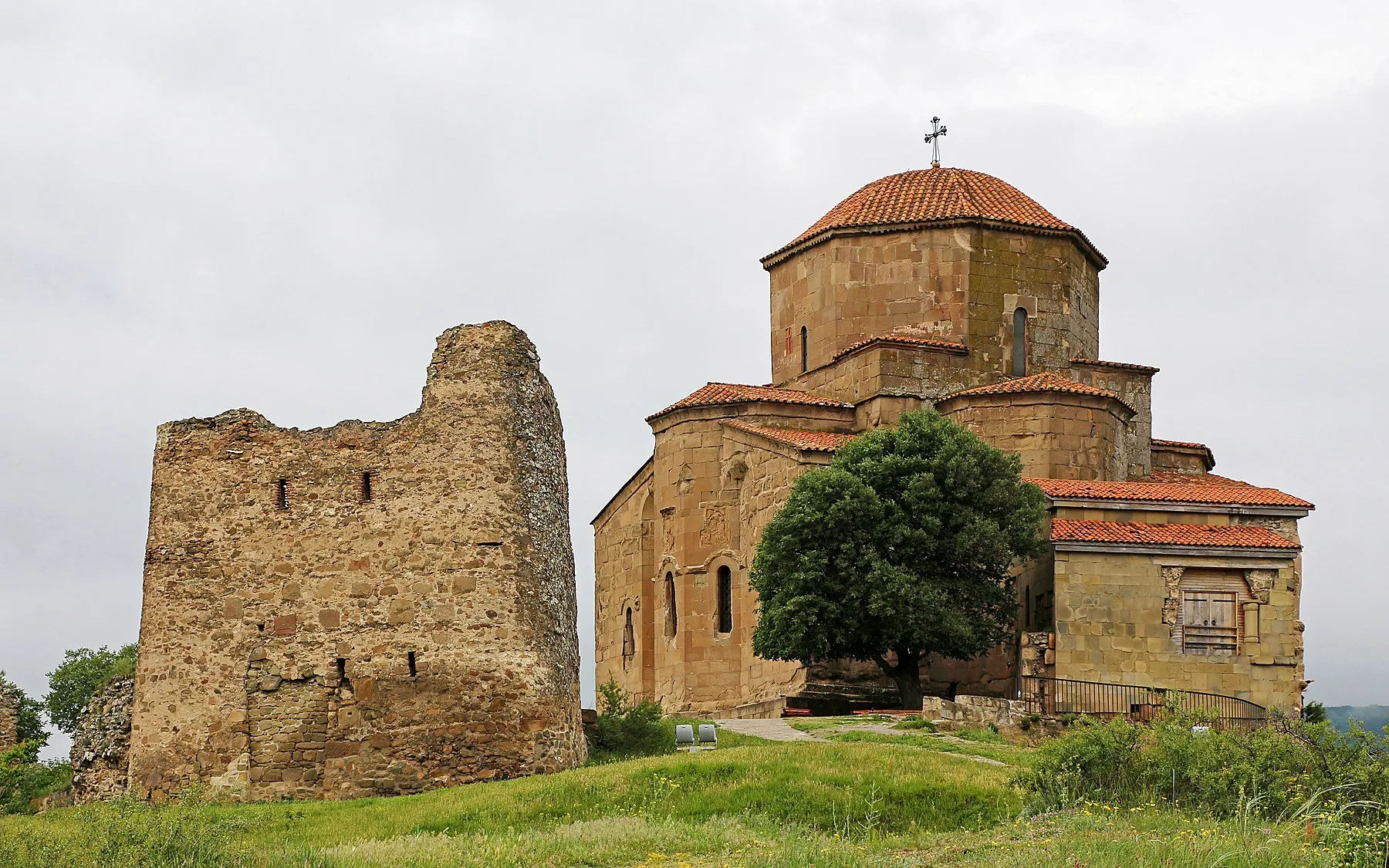 Jvari Monastery above the river confluence at sunset